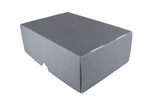 A plain gray cardboard box with a hinged lid, photographed on a white fabric backdrop.